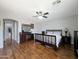 Spacious main bedroom features a ceiling fan, wood floors, and neutral paint at 14703 W Hillside St, Goodyear, AZ 85395
