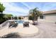 Beautiful pool area with lounge chairs, swaying palm trees, and a charming pergola at 14703 W Hillside St, Goodyear, AZ 85395