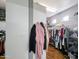 This walk-in closet has a built-in shelving system and plenty of room for storage at 14703 W Hillside St, Goodyear, AZ 85395