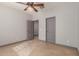 Bright bedroom with tile flooring and grey doors at 16229 W Jenan Dr, Surprise, AZ 85379