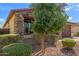 Charming front exterior with beautiful stone accents at 16229 W Jenan Dr, Surprise, AZ 85379
