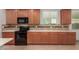 This kitchen features modern appliances, spacious countertops, and plenty of cabinet storage space at 16229 W Jenan Dr, Surprise, AZ 85379