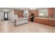 Well-appointed kitchen boasts an island, stainless appliances, and ample cabinet space for storage at 16229 W Jenan Dr, Surprise, AZ 85379