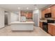 Stylish kitchen features an island, modern appliances, and beautiful countertops, perfect for cooking at 16229 W Jenan Dr, Surprise, AZ 85379