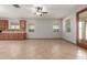Bright living space showcases tile flooring, multiple windows, and seamless indoor-outdoor flow at 16229 W Jenan Dr, Surprise, AZ 85379