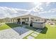 Backyard view with green turf and hot tub with mountain views at 17324 E Quail Track Rd, Rio Verde, AZ 85263