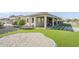 Backyard showcasing artificial turf and covered patio area with mountain views at 17324 E Quail Track Rd, Rio Verde, AZ 85263