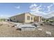 Property featuring gravel landscaping, a firepit, and mountain views at 17324 E Quail Track Rd, Rio Verde, AZ 85263