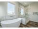 Luxurious bathroom with a standalone tub, a glass-enclosed shower, and elegant marble accents at 17324 E Quail Track Rd, Rio Verde, AZ 85263