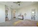 Spacious bedroom with an en suite bathroom and exterior exit; features neutral decor and modern furnishings at 17324 E Quail Track Rd, Rio Verde, AZ 85263