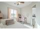 Cozy bedroom featuring a pink desk, chair, and window with natural light at 17324 E Quail Track Rd, Rio Verde, AZ 85263