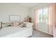 Bright bedroom with large window, and decor featuring a white comforter and plush pillows at 17324 E Quail Track Rd, Rio Verde, AZ 85263
