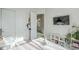 Bedroom showcasing TV, white shelving, and sliding closet doors at 17324 E Quail Track Rd, Rio Verde, AZ 85263
