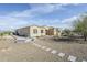 Home exterior featuring desert landscaping and a stone pathway at 17324 E Quail Track Rd, Rio Verde, AZ 85263