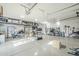 Spacious garage with ample storage shelves, fitness equipment and epoxy flooring at 17324 E Quail Track Rd, Rio Verde, AZ 85263