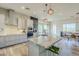 Spacious kitchen featuring a large center island, pendant lighting, and modern appliances at 17324 E Quail Track Rd, Rio Verde, AZ 85263
