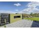 Backyard featuring a modern gas fireplace with outdoor decor and professional landscaping at 17324 E Quail Track Rd, Rio Verde, AZ 85263