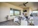 Cozy covered patio area with outdoor seating and mountain views at 17324 E Quail Track Rd, Rio Verde, AZ 85263