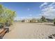 Backyard with a sand volleyball court and desert landscaping at 17324 E Quail Track Rd, Rio Verde, AZ 85263