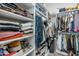 Spacious walk-in closet with abundant shelving and storage options for clothes, shoes, and accessories at 17324 E Quail Track Rd, Rio Verde, AZ 85263