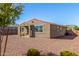 The spacious backyard features low-maintenance landscaping, offering room for customization at 17971 W Meadowbrook Ave, Goodyear, AZ 85395