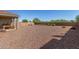 A spacious backyard with desert landscaping provides ample space for outdoor activities at 17971 W Meadowbrook Ave, Goodyear, AZ 85395