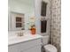 Bright bathroom with a white vanity, modern fixtures, flamingo print, and a decorative shower curtain at 17971 W Meadowbrook Ave, Goodyear, AZ 85395