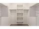 Walk-in closet with built-in shelving and hanging rods for optimal organization at 17971 W Meadowbrook Ave, Goodyear, AZ 85395