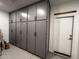 A spacious garage features ample storage cabinets, and convenient garage access at 17971 W Meadowbrook Ave, Goodyear, AZ 85395