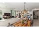 Open-concept living space featuring modern décor, a dining area, and a well-equipped kitchen for seamless entertaining at 17971 W Meadowbrook Ave, Goodyear, AZ 85395