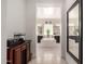 This primary bathroom features a standalone tub and dual vanities with plenty of counter space at 18134 W Highland Ave, Goodyear, AZ 85395