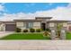 Beautiful single-story home with manicured front lawn and neutral stucco facade at 18134 W Highland Ave, Goodyear, AZ 85395