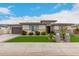 Beautiful single-story home with manicured front lawn and neutral stucco facade at 18134 W Highland Ave, Goodyear, AZ 85395