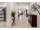 Open foyer with tiled flooring leads to dining and living areas at 18134 W Highland Ave, Goodyear, AZ 85395