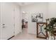 Bright hallway with a view into a storage room and decorative mirror at 18134 W Highland Ave, Goodyear, AZ 85395
