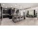 Open kitchen boasts granite countertops, an island with seating, and stainless steel appliances at 18134 W Highland Ave, Goodyear, AZ 85395