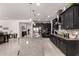 Charming gourmet kitchen boasts granite countertops, stainless steel appliances, and tile flooring at 18134 W Highland Ave, Goodyear, AZ 85395