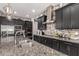 Gourmet kitchen featuring stainless steel appliances, and custom cabinetry with updated lighting at 18134 W Highland Ave, Goodyear, AZ 85395