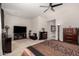 This main bedroom boasts neutral carpet, ceiling fan, and lots of space to spread out at 18134 W Highland Ave, Goodyear, AZ 85395