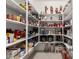 Spacious pantry features lots of shelving to accommodate all of your storage needs at 18134 W Highland Ave, Goodyear, AZ 85395