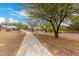 The neighborhood's walking path through green spaces is perfect for daily strolls and exercise at 18134 W Highland Ave, Goodyear, AZ 85395