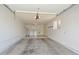 Spacious two-car garage with washer, dryer, utility sink, and ample storage space at 18610 N Mica Dr, Sun City West, AZ 85375