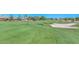 Lush green golf course with pristine fairways, scenic views, and a sand trap hazard at 18610 N Mica Dr, Sun City West, AZ 85375