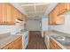 Functional kitchen with oak cabinets, granite countertops, and modern appliances at 18610 N Mica Dr, Sun City West, AZ 85375
