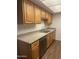 Kitchen featuring wood cabinets, granite countertops and stainless-steel appliances at 18610 N Mica Dr, Sun City West, AZ 85375