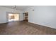 Open living area with tile flooring and sliding door access to the backyard offers a bright and airy atmosphere at 18610 N Mica Dr, Sun City West, AZ 85375