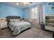 Bright bedroom featuring neutral tones, plush carpeting, and soft lighting creating a peaceful retreat at 19203 S 185Th Dr, Queen Creek, AZ 85142