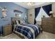 Charming bedroom featuring baseball themed decor and furnishings creating a fun and inviting space at 19203 S 185Th Dr, Queen Creek, AZ 85142