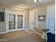 Entryway featuring wood-look tile, shuttered sidelight, and glass panel French doors at 19203 S 185Th Dr, Queen Creek, AZ 85142