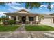 Charming single-story home featuring a landscaped front yard, covered porch, and two-car garage at 19203 S 185Th Dr, Queen Creek, AZ 85142
